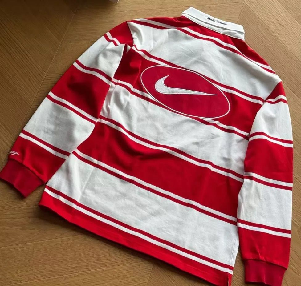 NIKE X SUPREME RUGBY POLO (Category: Tshirts & Polo Shirts ) located in Caloocan City. Submitted by dontii (Listing ID 1423421815, Image 3). Description: - Nike x Supreme Rugby Polo - Long-sleeved design - Features bold horizontal stripes - Nike swoosh logo on the front and back - Supreme branding on the collar and sleeve - Available in multiple colorways (red, black) - Comfortable material - Perfect for streetwear style.