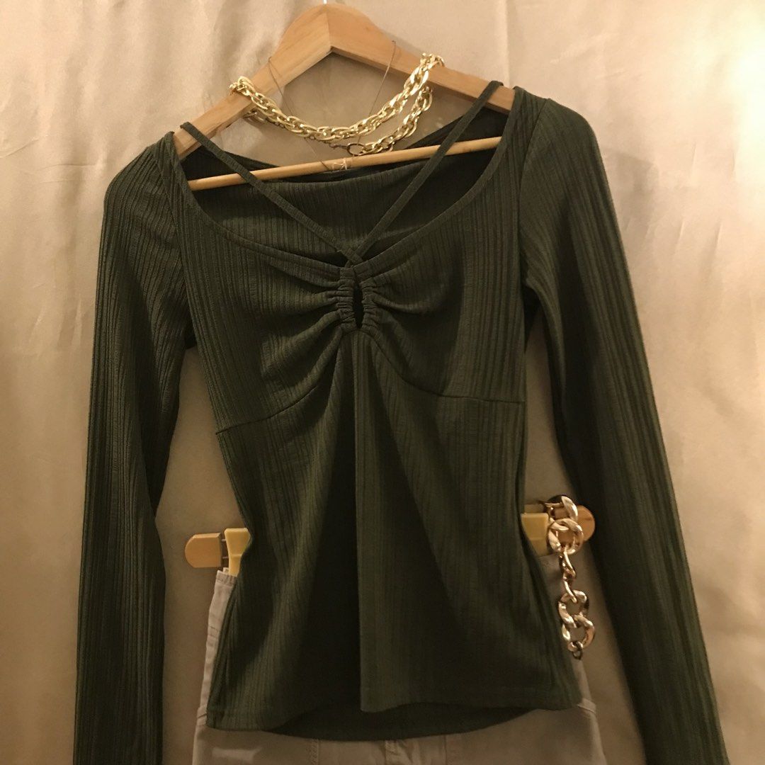 Olive Green Cut out Long Sleeve Top (Category: Longsleeves) located in Manila. Submitted by 414studio (Listing ID 1423389846, Image 1). Description: Stretchable fabric Fits Small to Medium Cut out details Shipping: Lalamove/Gogoxpress.