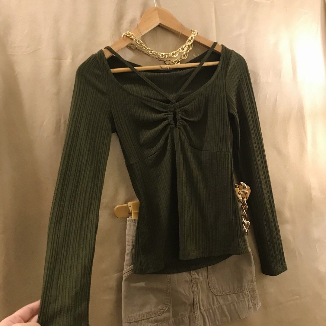 Olive Green Cut out Long Sleeve Top (Category: Longsleeves) located in Manila. Submitted by 414studio (Listing ID 1423389846, Image 3). Description: Stretchable fabric Fits Small to Medium Cut out details Shipping: Lalamove/Gogoxpress.