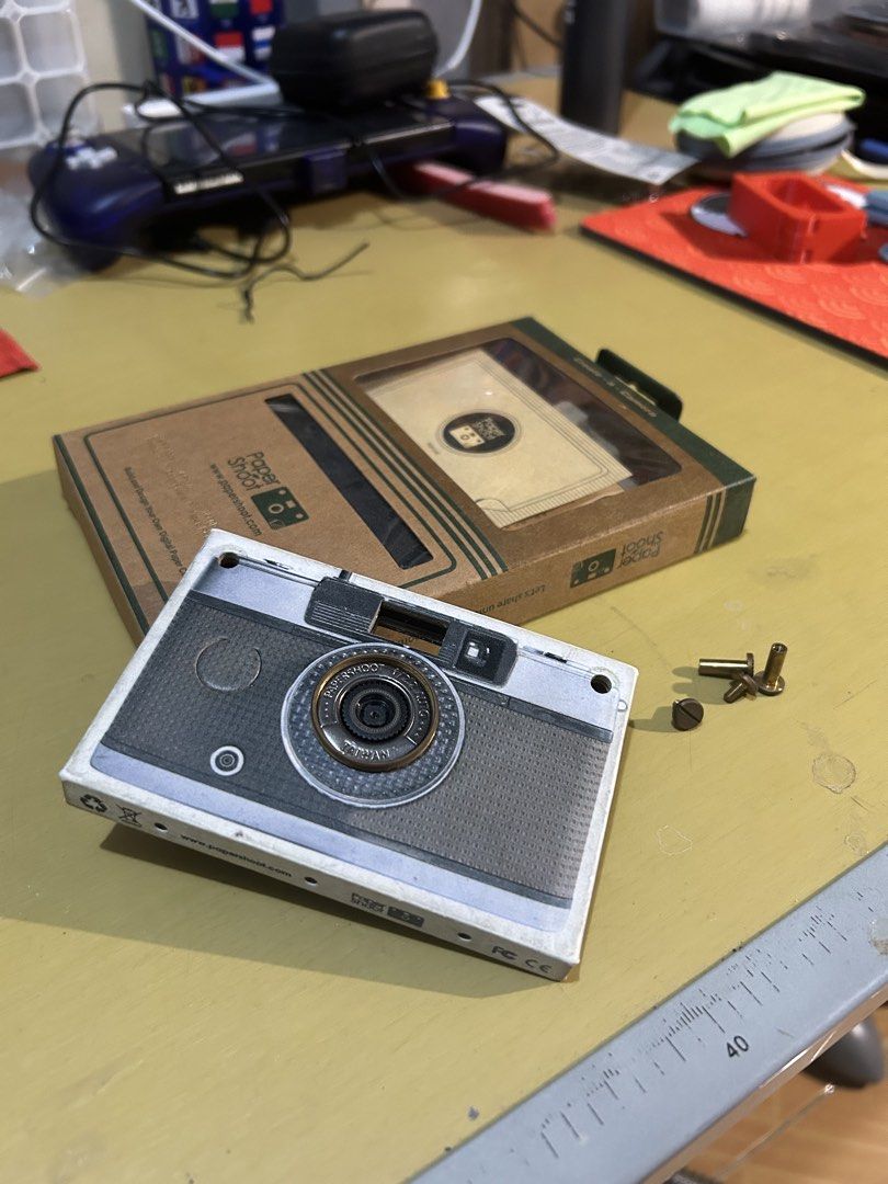 Paper Shoot Camera [18 MP] (Category: Cameras) located in Pasay City. Submitted by emiliorufusbunani (Listing ID 1423364882, Image 1). Description: FOR SALE: Paper Shoot V2 [18 MP Camera] 📷 RFS: Not using it and Not my style of Camera Bought it before as a novelty pero 'di ko gusto yung walang flash Used it around 3x then hid the camera as I didn't want to use it anymore 🥹 Includes: - Case (1961 version) (8/10 condition) (madumi lang) - 1 Camer