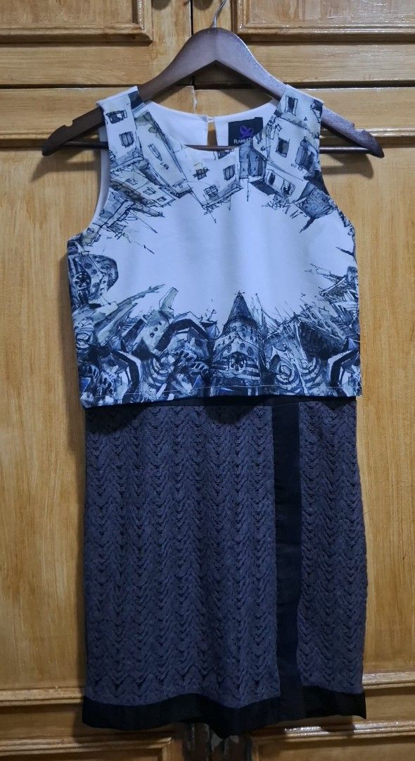 Plains & Prints Sleeveless Dress (Category: Dresses) located in Quezon City. Submitted by MP_Declutters (Listing ID 1423318828, Image 1). Description: Plains & Prints Sleeveless Dress – Preloved ✨ Stylish and unique Plains & Prints sleeveless dress featuring an artistic printed bodice and a textured dark gray skirt. A versatile piece that's perfect for casual outings, office wear, or semi-formal occasions. ✔ Unique monochrome architectural print 