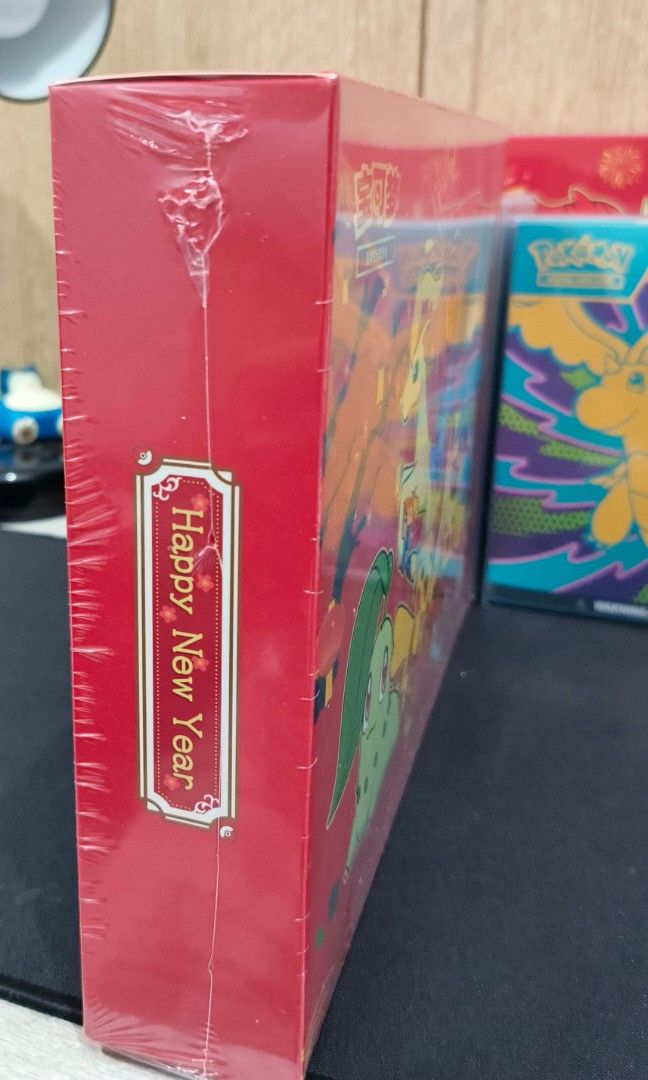 Pokemon Lunar New Year Gift Box (Category: Character Goods) located in Manila. Submitted by chaelseb (Listing ID 1422546199, Image 2). Description: !!!RUSH SALE till 4-20-26!!! - Red Pokemon Lunar New Year Gift Box - Features various Pokemon characters - Includes Chinese characters - Festive design with fireworks and celebratory elements - Ideal for gifting during Lunar New Year.