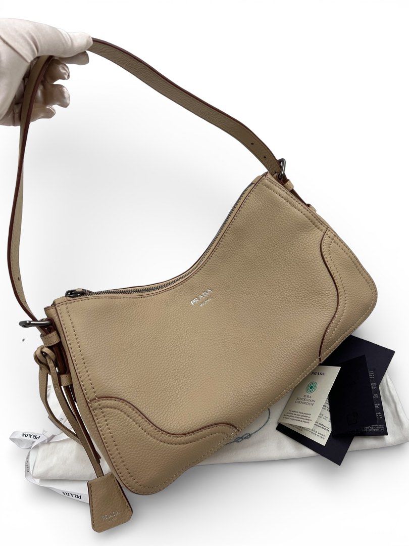 ⚜️Prada ⊹₊ Aimèe large leather shoulder bag (Category: Luxury Bags & Wallets) located in Makati City. Submitted by 90sangel (Listing ID 1423424082, Image 2). Description: •Item: Prada Aimee - Iconic travel/office bag! •Size 20 x 36 large •Condition: Excellent! No issue *W/ Removable key ring, also rich texture of leather characterized by its fine, irregular grain for a natural yet refined effect. ⊹₊⟡⋆ *Includes dustbag, authenticity card and big 