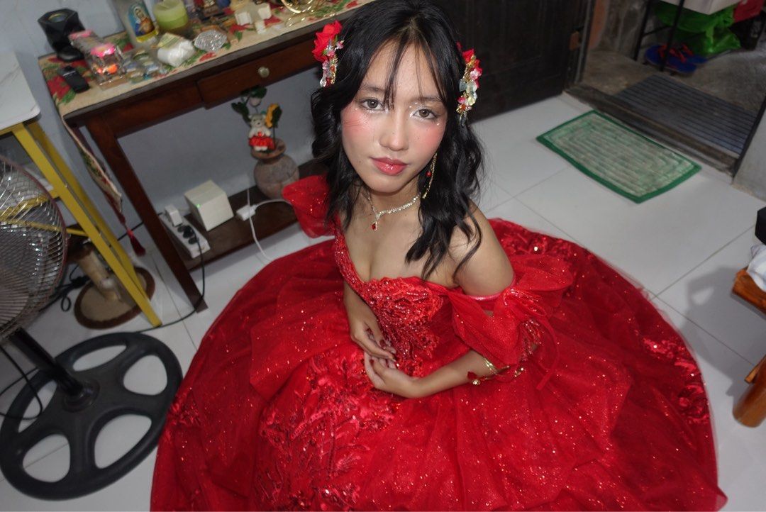 Red Shiny Ball Gown with Freebies (Category: Evening dresses & gowns) located in Santa Rosa. Submitted by sweetsillystuff (Listing ID 1423360487, Image 2). Description: - Elegant red ball gown - Off-shoulder design - Intricate embroidery - Layered skirt - Sweetheart neckline - Fitted bodice - Floor-length - Shimmering fabric - Perfect for special occasions, debut, js prom - with free gloves, headpiece, necklace, earclip and veil.