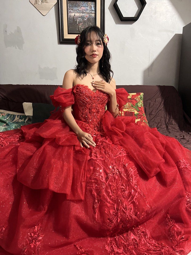 Red Shiny Ball Gown with Freebies (Category: Evening dresses & gowns) located in Santa Rosa. Submitted by sweetsillystuff (Listing ID 1423360487, Image 1). Description: - Elegant red ball gown - Off-shoulder design - Intricate embroidery - Layered skirt - Sweetheart neckline - Fitted bodice - Floor-length - Shimmering fabric - Perfect for special occasions, debut, js prom - with free gloves, headpiece, necklace, earclip and veil.