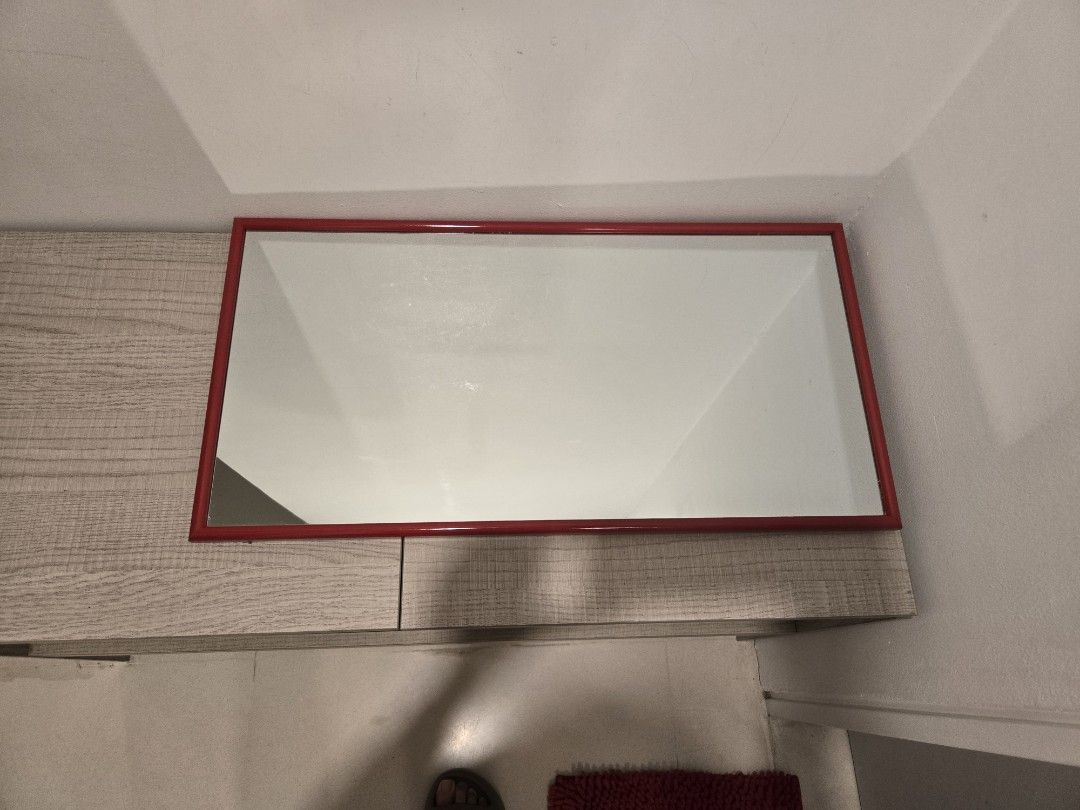 Red Framed Rectangular Mirror (Category: Mirrors) located in Kuala Lumpur. Submitted by kryptonite_love (Listing ID 1423386366, Image 2). Description: Rectangular mirror with a red frame. It is suitable for various spaces, such as a bathroom or bedroom. The frame is a vibrant red, adding a pop of color to any room. The mirror is ready to be mounted. 63cm x 32.5cm.