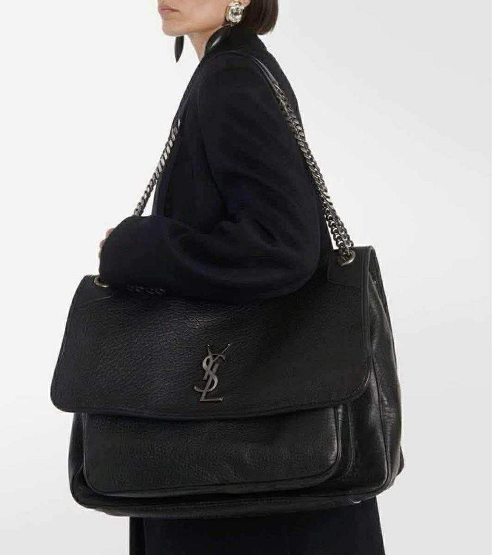 Saint Laurent Black Chain Bag big size (Category: Luxury Bags & Wallets) located in Los Banos. Submitted by ditasbautista2329 (Listing ID 1423432929, Image 1). Description: - Saint Laurent handbag - Black textured leather exterior - Features the iconic YSL logo - Silver chain strap - Flap closure - Multiple interior compartments - Includes Saint Laurent Paris label and tag.