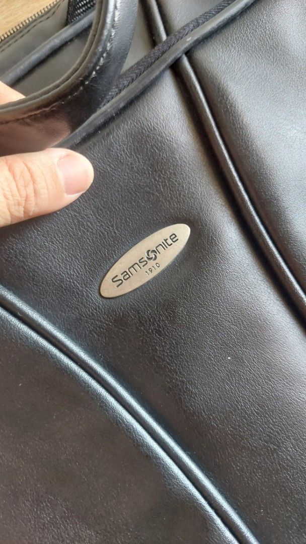 Samsonite Black Laptop Bag (Category: Laptop Bags & Sleeves) located in Quezon City. Submitted by sarisaribyronah (Listing ID 1423363704, Image 1). Description: - Black Samsonite laptop bag - Includes a shoulder strap and handle - Multiple compartments for organization - Features several zippered pockets - Durable material - Sleek design - Interior pockets for belongings Price negotiable.