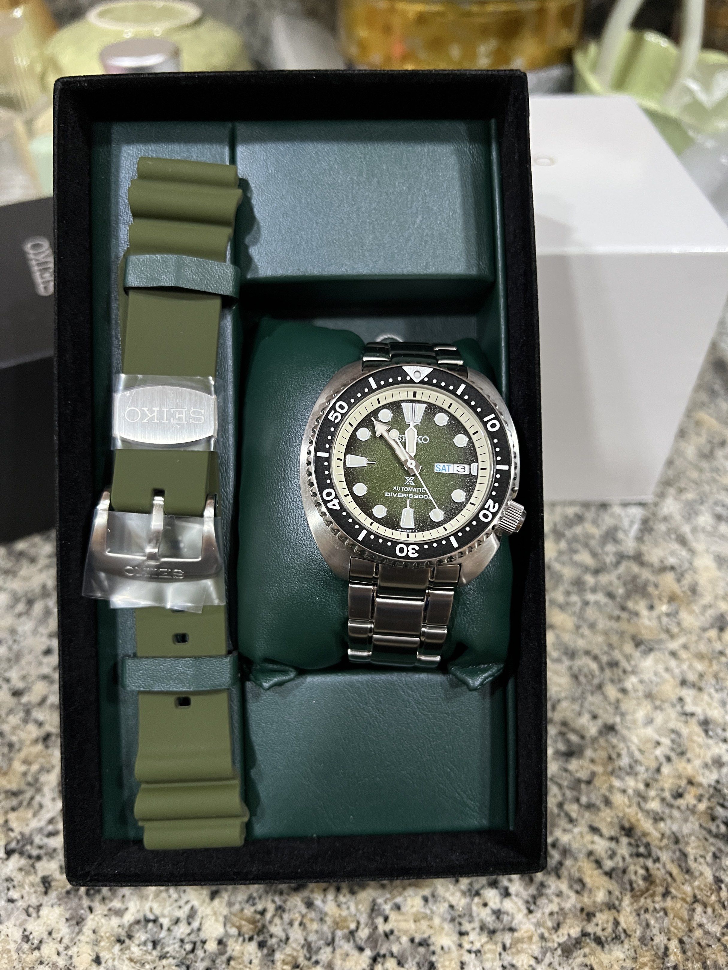 Seiko Prospex 'Turtle' Green Dial (Category: Luxury Watches) located in Manila. Submitted by jorelldizon33-00102 (Listing ID 1423308682, Image 1). Description: - Seiko Prospex 'Turtle' watch - Green dial - Includes stainless steel bracelet and green rubber strap - Comes with original box - Rotating bezel - Day-date display - Luminous markers and hands.
