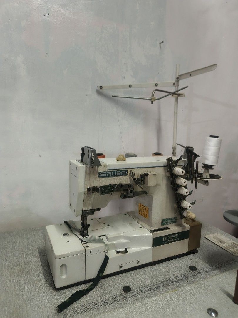 Siruba F007W Overlock Sewing Machine (Category: Craft Supplies & Tools) located in Manila. Submitted by keopiko (Listing ID 1423414115, Image 3). Description: - Siruba F007W overlock sewing machine flat bed Features multiple thread spools Built-in cutting mechanism 3mos warranty Running condition Ready to use 2nd hand New table Message for inquiries Pm there's other Units available.