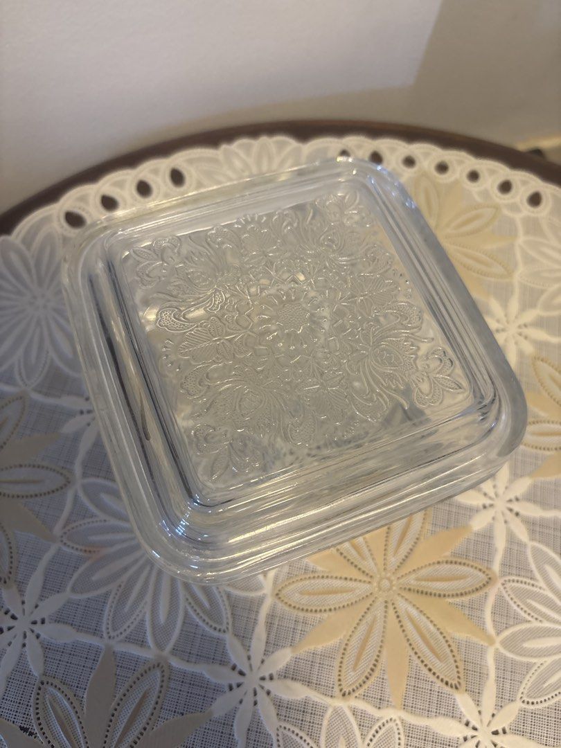 Square Glass Container with Lid (Category: Storage Boxes & Baskets) located in Calamba. Submitted by cur8d (Listing ID 1423313961, Image 2). Description: - Square glass container - Matching lid with floral pattern - Clear, thick glass - Rounded edges - Small chip on lid corner - Ideal for storing small items.