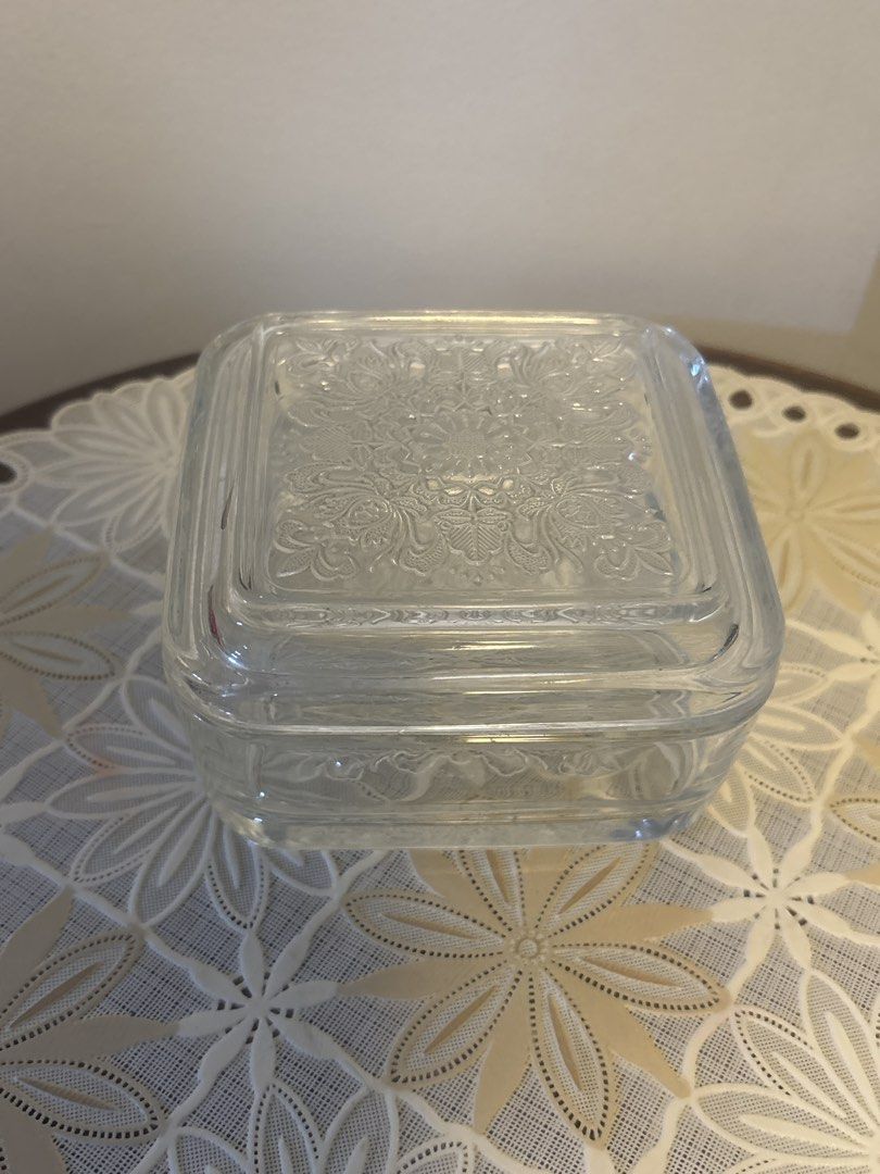 Square Glass Container with Lid (Category: Storage Boxes & Baskets) located in Calamba. Submitted by cur8d (Listing ID 1423313961, Image 1). Description: - Square glass container - Matching lid with floral pattern - Clear, thick glass - Rounded edges - Small chip on lid corner - Ideal for storing small items.