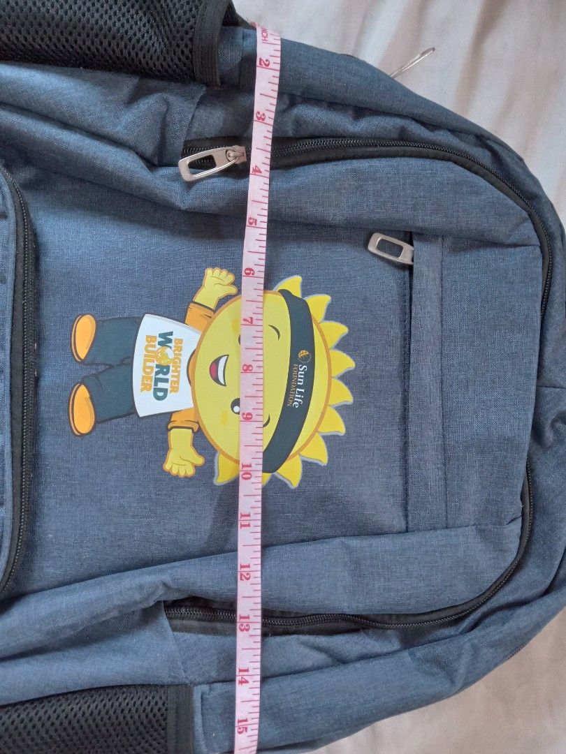 Sun Life Foundation Backpack (Category: Backpacks) located in Mandaluyong City. Submitted by gian0909 (Listing ID 1423303661, Image 3). Description: - Sun Life Foundation backpack - Color: Blue - Design: Features a cartoon character - Main compartment with divider - Front pocket - Adjustable straps - Mesh side pockets.