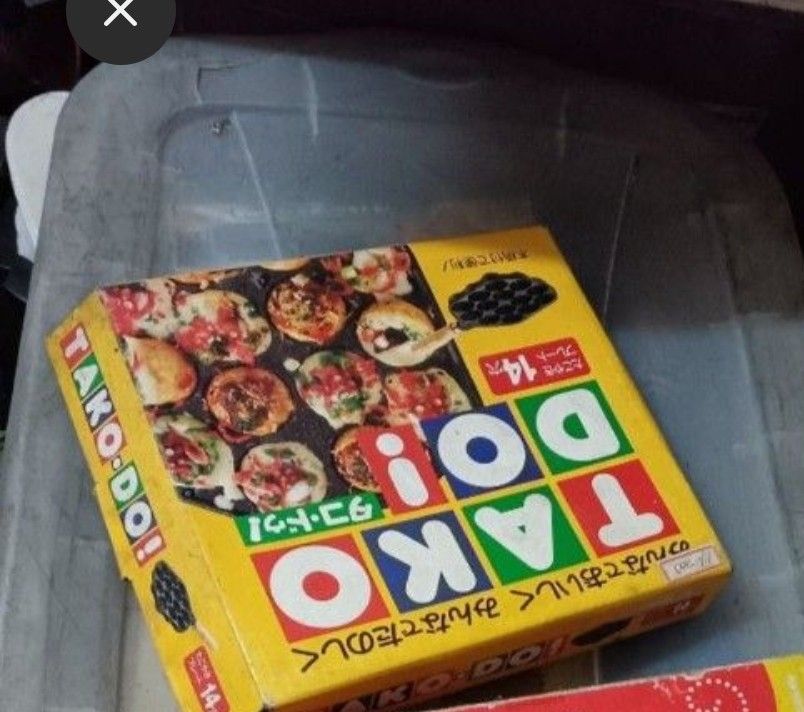 Takoyaki Pan cast iron japan (Category: Cookware & Accessories) located in Caloocan City. Submitted by toys_r_here (Listing ID 1423368464, Image 3). Description: - Brand new Takoyaki pan from Tako-Do. - Features 14 circular molds. - Unused and in original packaging. - Box includes images of cooked takoyaki. - Ideal for making delicious takoyaki at home..