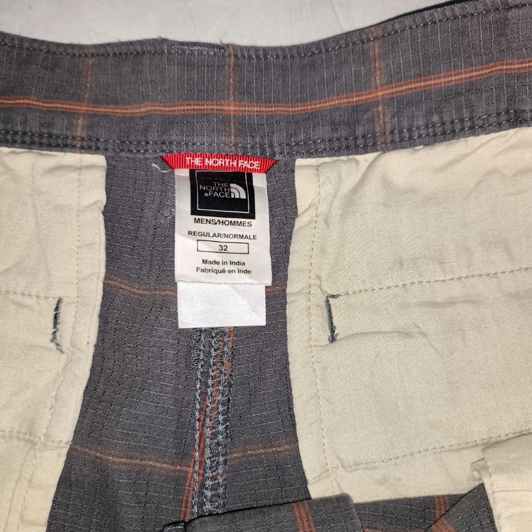 The North Face Plaid Shorts - Size 32 (Category: Shorts) located in Manila. Submitted by jericoeco (Listing ID 1423285874, Image 2). Description: - The North Face plaid shorts - Size: 32 - L:23|W:34|HEM:12 - Color: Brown and orange plaid - Features: Button closure, pockets - Made in India - Designed for men.