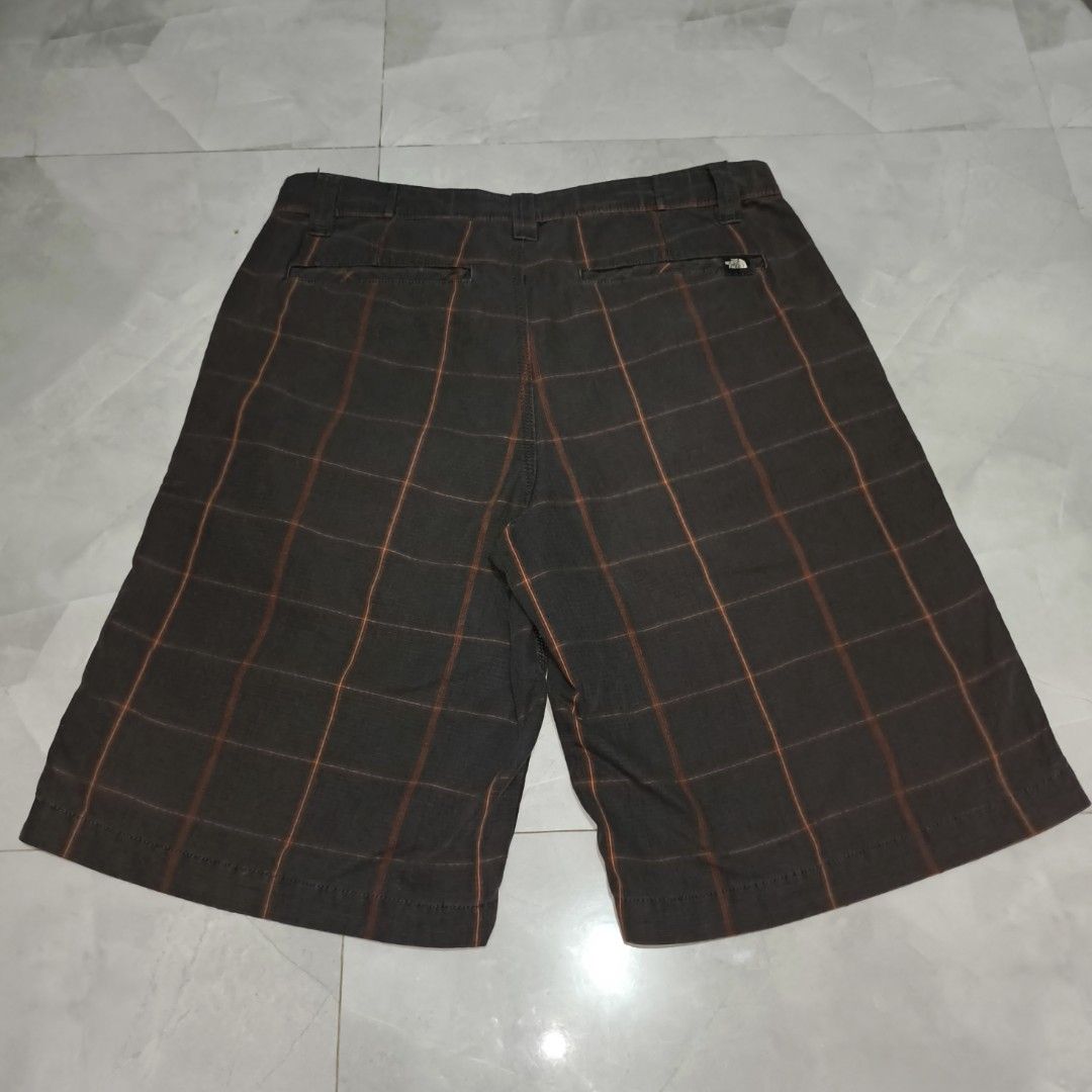 The North Face Plaid Shorts - Size 32 (Category: Shorts) located in Manila. Submitted by jericoeco (Listing ID 1423285874, Image 3). Description: - The North Face plaid shorts - Size: 32 - L:23|W:34|HEM:12 - Color: Brown and orange plaid - Features: Button closure, pockets - Made in India - Designed for men.