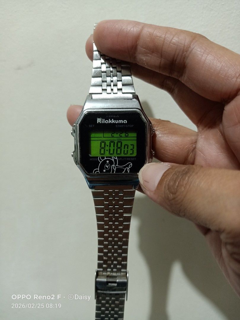 Timex Rilakkuma Digital Watch (Category: Men's Watches) located in Quezon City. Submitted by daisyuy1979 (Listing ID 1423260951, Image 2). Description: - Rilakkuma design digital watch - Stainless steel back - Metal band - Displays time digitally - Uses CR2016 battery.