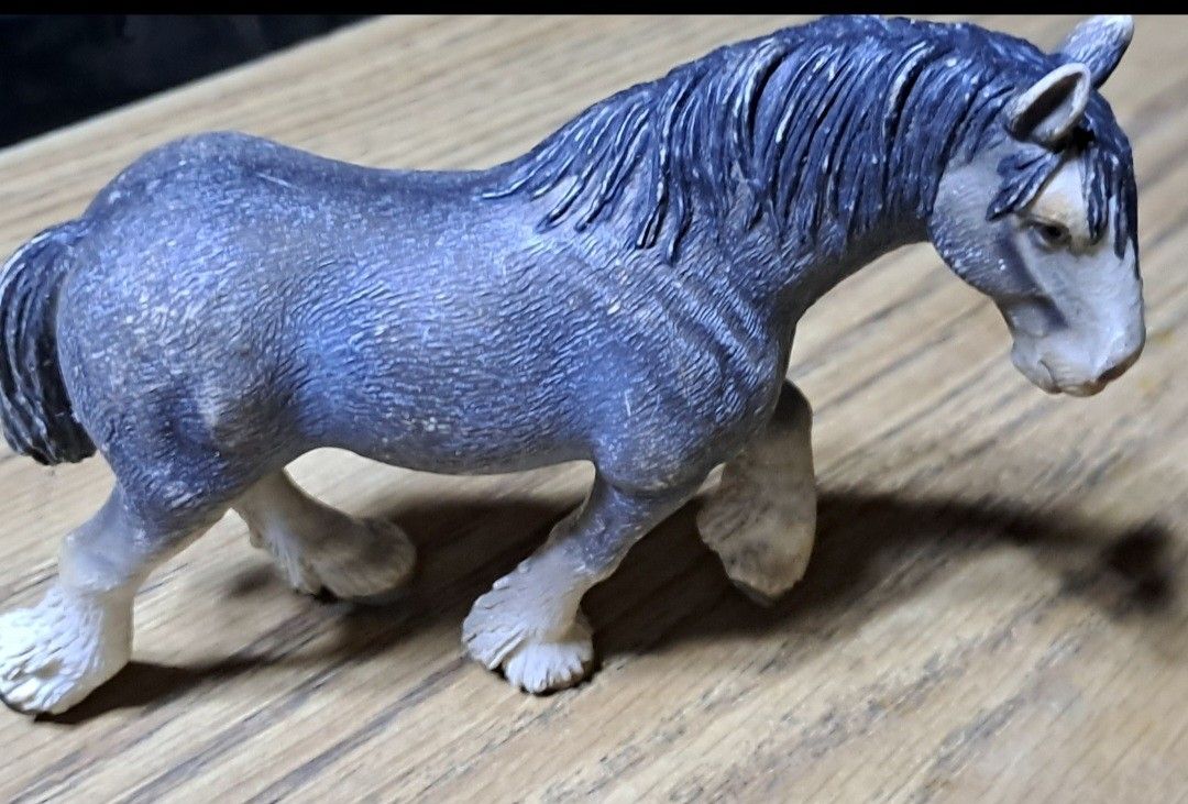 Toy Horse Figure (Category: Figurines & Statues) located in Davao. Submitted by bravemoon_556cd5 (Listing ID 1423284815, Image 2). Description: - Detailed toy horse figure - Blue-grey coat with white markings - Dark blue mane and tail - Walking pose - Solid, well-crafted material.