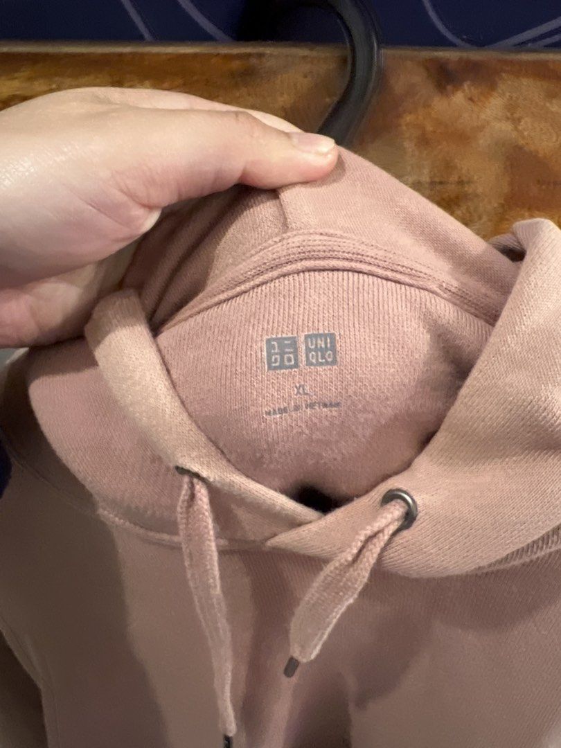 Uniqlo Hoodie - XL (Category: Hoodies) located in Baguio. Submitted by rhyac (Listing ID 1423302721, Image 2). Description: - Uniqlo hoodie in light pink - Size: XL - Features: Drawstring hood, kangaroo pocket - Made in Vietnam - Soft and comfortable material - Versatile for various outfits.