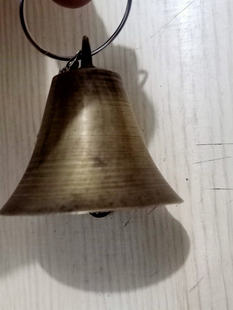 Vintage Brass Bell with Ring (Category: Vintage Collectibles) located in Las Pinas. Submitted by the_recycle_shop (Listing ID 1423397312, Image 1). Description: - Vintage brass bell - Classic bell shape with flared bottom - Tarnished finish - Includes clapper - Ring attached for hanging or carrying.