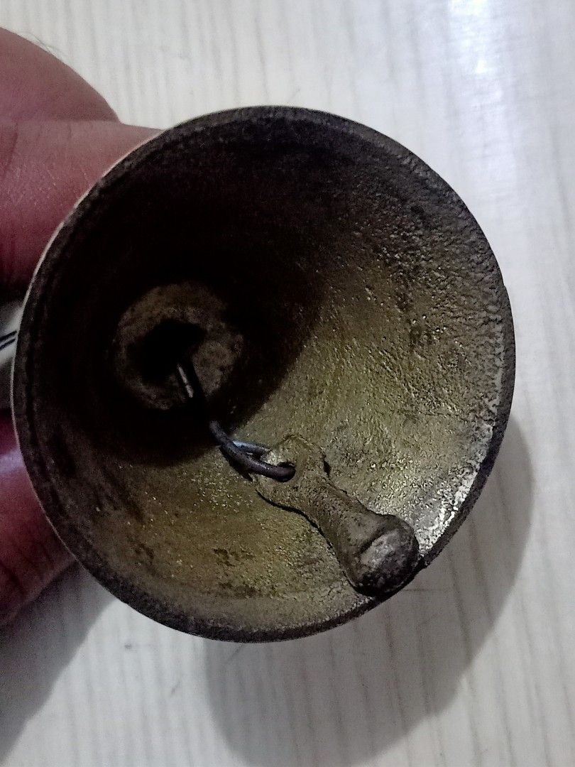 Vintage Brass Bell with Ring (Category: Vintage Collectibles) located in Las Pinas. Submitted by the_recycle_shop (Listing ID 1423397312, Image 3). Description: - Vintage brass bell - Classic bell shape with flared bottom - Tarnished finish - Includes clapper - Ring attached for hanging or carrying.