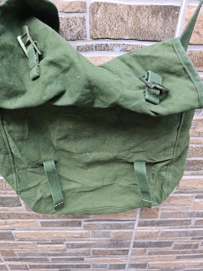 Vintage Green Messenger Bag (Category: Luxury Bags & Wallets) located in San Jose del Monte. Submitted by levanthrift (Listing ID 1423310724, Image 3). Description: Milit bag 1981 12x3 1/3 x 10 inches 350 only Sjdm bulacan. Green messenger bag - Adjustable strap - Flap closure with buckles - Durable, canvas-like material - Rectangular shape - Single main compartment - White lining with blue stamp.