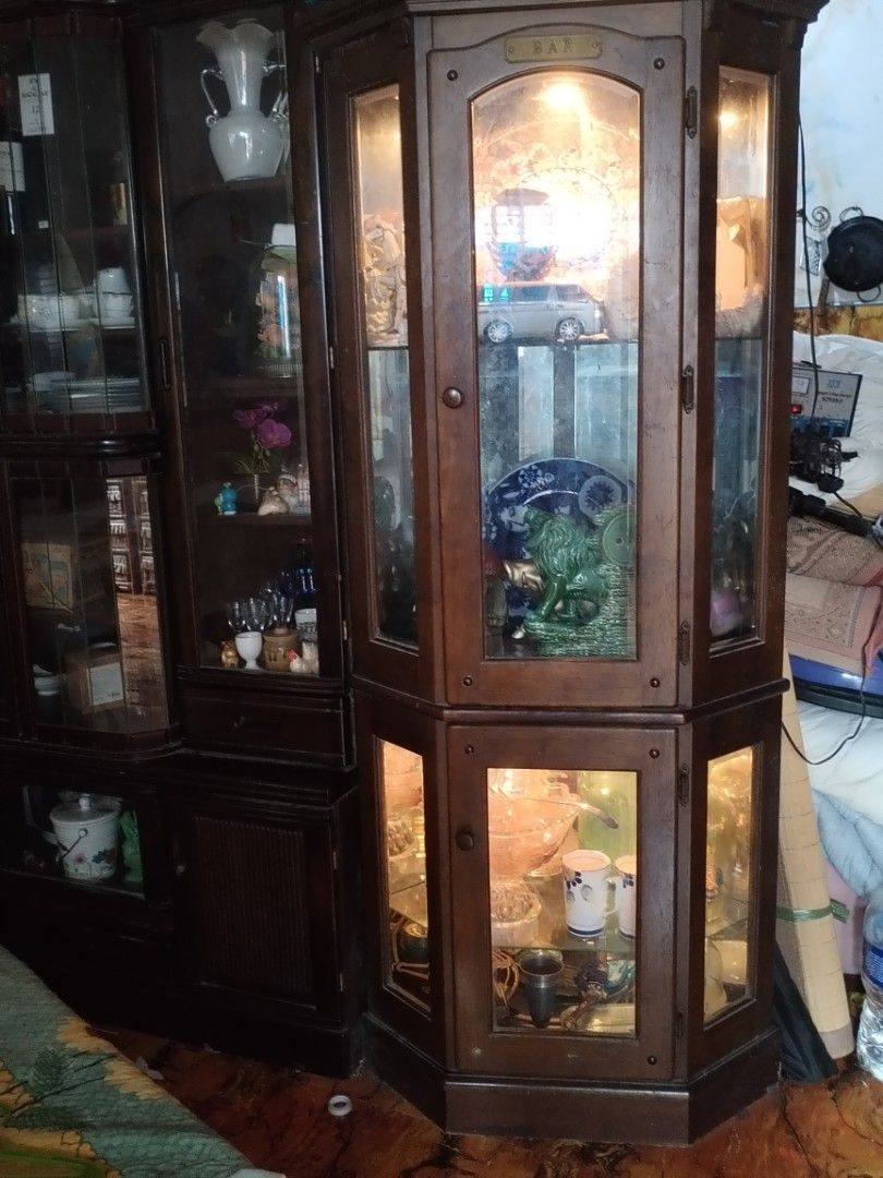 Vintage Wooden Display Cabinet (Category: Shelves, Cabinets & Racks) located in Caloocan City. Submitted by rowely_jpn (Listing ID 1423303496, Image 1). Description: - Vintage display cabinet - Classic design with glass panels - Multiple shelves for display - Ideal for collectibles and figurines - Made of wood - Adds a warm touch to any room.