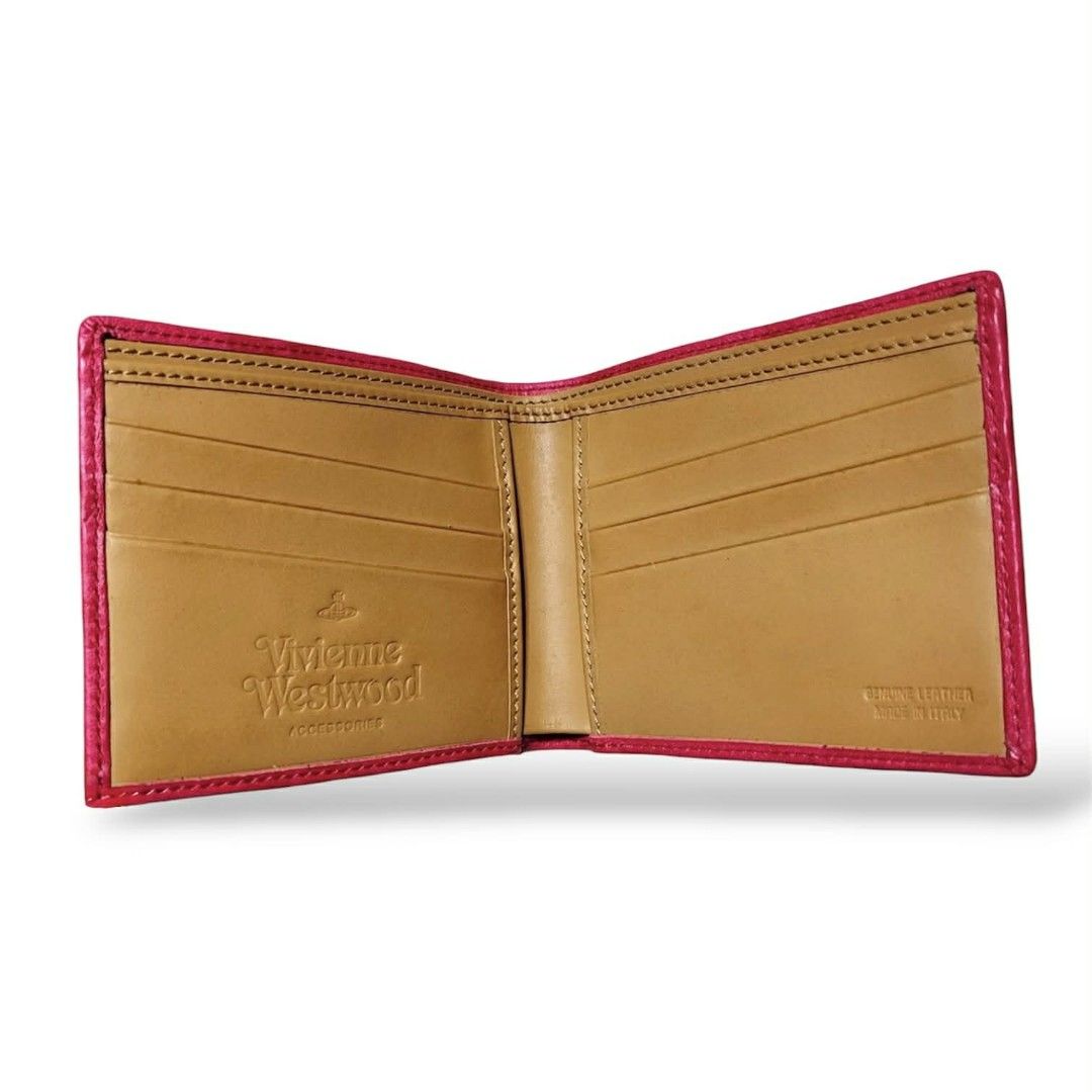Vivienne Westwood Squiggle Bifold Wallet (authentic) (Category: Luxury Bags & Wallets) located in Cebu City. Submitted by westleygics18 (Listing ID 1423424165, Image 3). Description: Vivienne Westwood Squiggle Bifold Wallet (authentic) - Brand new Condition - Made in Italy - 100% Genuine Leather - Fuchsia / Raspberry Pink with Tan/Beige interior - 8 Card slots (4 on each side) - 2 Side slip pockets - Double bill compartment with red fabric lining