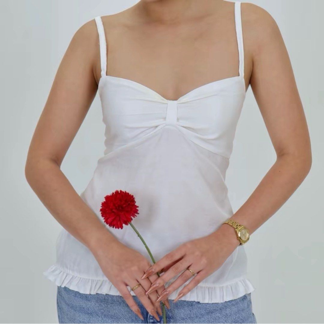 white ribbon ruffled cami top (Category: Sleeveless) located in Taytay. Submitted by bye_bye_stuff (Listing ID 1423274638, Image 1). Description: only worn once see photo for measurements can fit xs to medium mop: gcash/bank mod: j&t or lalamove no cod, payment first pin loc: mabaya manila / 33 b pagasa taytay text 09565609932 if i’m not responding here .