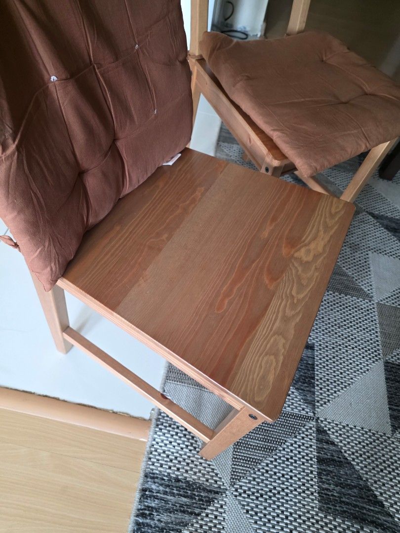 Wooden Chairs with Cushions (Category: Chairs) located in Manila. Submitted by nick85284 (Listing ID 1423329869, Image 3). Description: - Set of two wooden chairs. - Features a simple, minimalist design. - Light wood finish. - Includes soft, brown cushions for comfort. - Ideal for living rooms, balconies, or extra seating needs..