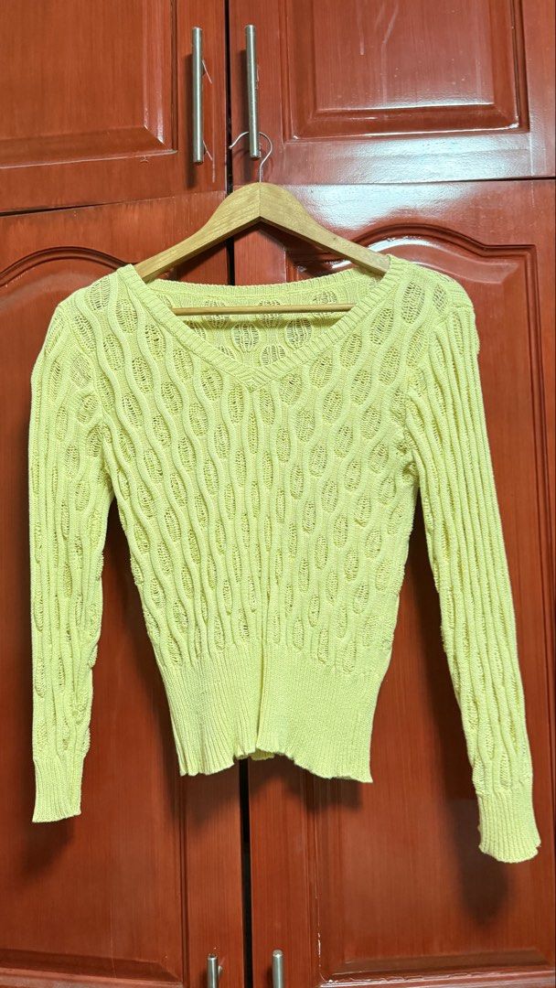 Yellow Knit Sweater (Category: Longsleeves) located in Amadeo. Submitted by beaflr (Listing ID 1423406810, Image 1). Description: - Pastel yellow knit sweater - V-neck design - Long sleeves - Unique textured pattern - Fitted silhouette - Ribbed hem and cuffs - Lightweight knit - Ideal for layering.