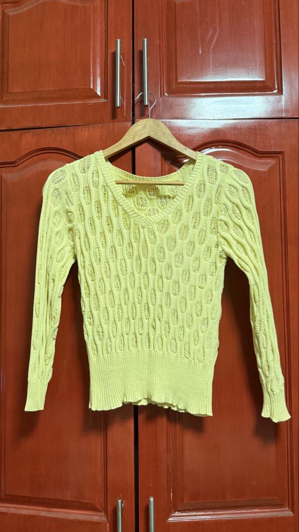 Yellow Knit Sweater (Category: Longsleeves) located in Amadeo. Submitted by beaflr (Listing ID 1423406810, Image 2). Description: - Pastel yellow knit sweater - V-neck design - Long sleeves - Unique textured pattern - Fitted silhouette - Ribbed hem and cuffs - Lightweight knit - Ideal for layering.