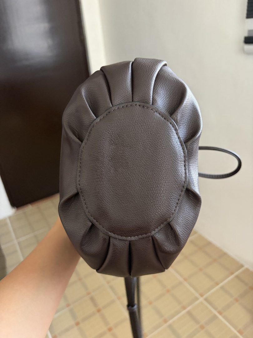Zara Bucket Bag in Dark Brown (Category: Shoulder Bags) located in Las Pinas. Submitted by ynalcx (Listing ID 1423320278, Image 3). Description: - RFS: Impulse buy - ‼️: Has minimal cracking on top part of the bag, CHECK PHOTOS FIRST. - Bought in Japan - Can be worn as a handbag or as a crossbody - Handbag strap and crossbody strap are both detachable - Pouch inside is also detachable.