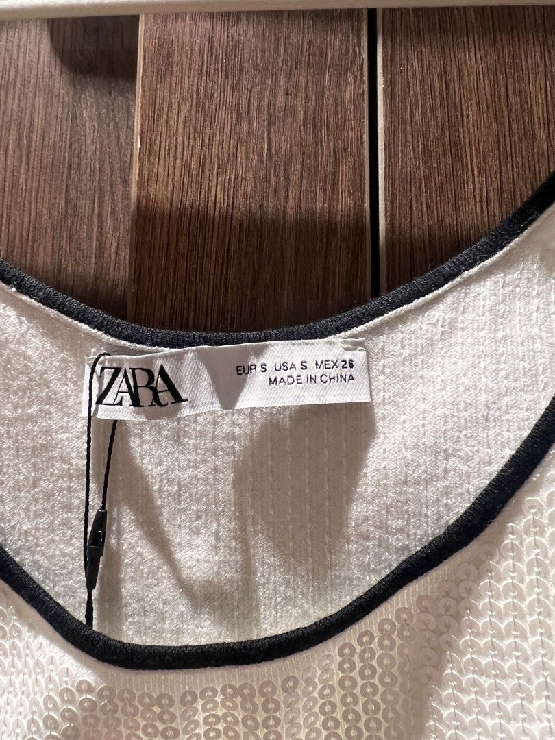Zara White Sequin Tank Top with Black Trim (Category: Sleeveless) located in Quezon City. Submitted by _dolfin (Listing ID 1423355218, Image 3). Description: Brand New, Never Worn RFS: Decluttering.