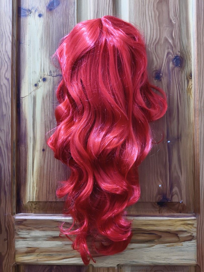 22 Inches Long Red Curly Wig (Category: Hair Accessories) located in Bontoc. Submitted by shaneebhee (Listing ID 1423485795, Image 1). Description: - Long, vibrant red curls - Center part - Mesh cap with adjustable straps - Made of synthetic fibers - Perfect for cosplay, costume parties, or a bold look.