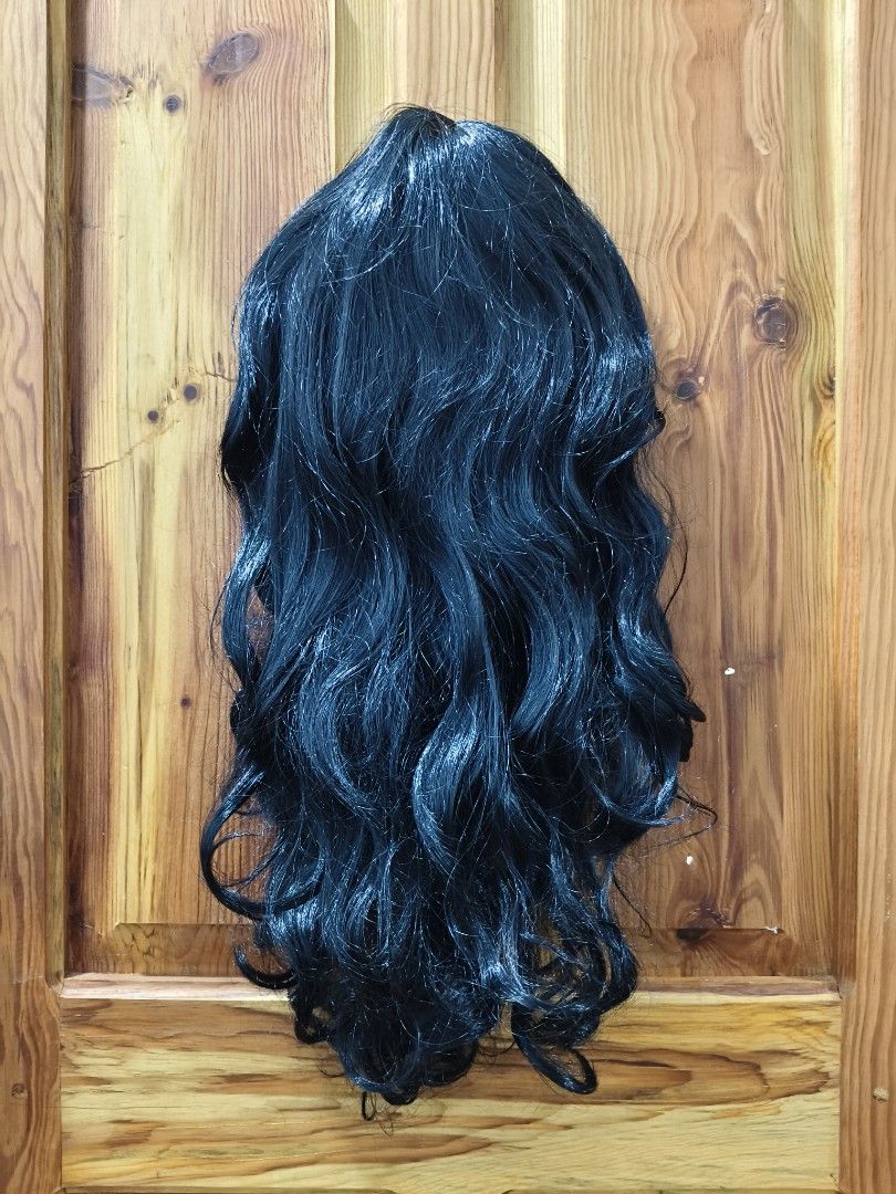 25 Inches Long Black Curly Wig (Category: Hair Accessories) located in Bontoc. Submitted by shaneebhee (Listing ID 1423486327, Image 1). Description: - Long, wavy black hair - Breathable mesh cap - Adjustable straps for secure fit - Ready to wear - Style to your preference - Perfect for cosplay & costume parties - Brandnew (no tag) .