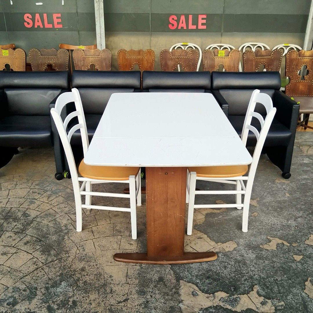 2nd hand Extendable Table with 2 Chairs | 3pcs set (Category: Tables & Sets) located in Paranaque City. Submitted by 2ndcharmfurniture (Listing ID 1423525110, Image 2). Description: Dining set includes an extendable table and two chairs. The table dimensions are L92-120cm, W75cm, and H71cm. The chairs are L40cm, D38cm, and H84cm, with a seat height of 44cm. The table is white, and the chairs have white frames with wooden seats. The set is perfect