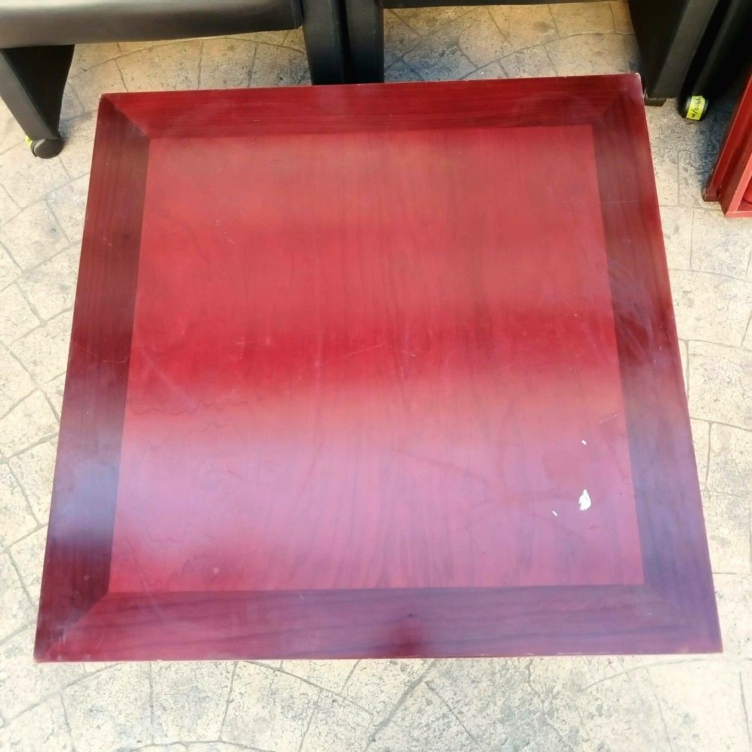 2nd hand Square Wooden Coffee Table | Foldable Legs (Category: Tables & Sets) located in Paranaque City. Submitted by 2ndcharmfurniture (Listing ID 1423525518, Image 3). Description: Square wooden coffee table with a rich red finish. The table has a classic design with a sturdy base. Dimensions are L80cm x W80cm x H33cm. Perfect for living rooms or lounges. A practical and stylish addition to any space..