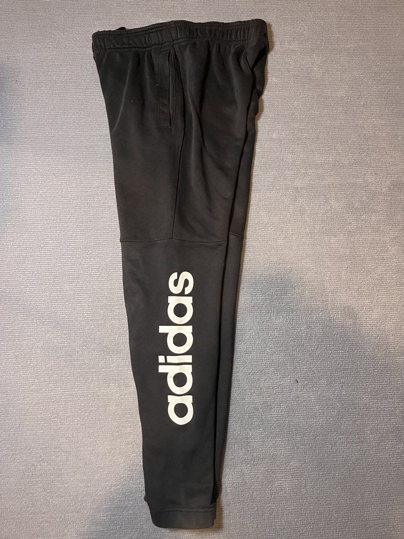 Adidas Black Sweatpants A/M 175/80A (Category: Joggers) located in Itogon. Submitted by taulom (Listing ID 1423543546, Image 2). Description: - Black Adidas sweatpants - Features Adidas logo on left leg and wordmark on right leg - Size: A/M 175/80A - Elastic waistband - Pockets included.