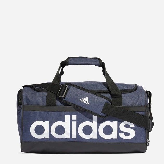 Adidas Linear Duffel Bag S (Category: Sling Bags) located in Calamba. Submitted by copanddrip (Listing ID 1423535128, Image 1). Description: Adidas duffel bag in navy blue with white Adidas logo. Features a main compartment, a side pocket, and a detachable shoulder strap. Includes top handles for carrying. Perfect for gym, travel, or everyday use..