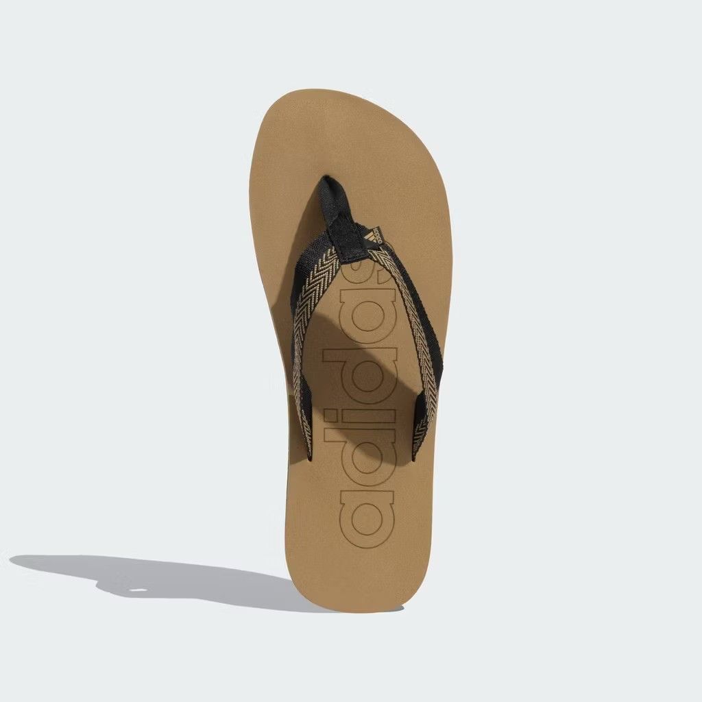 Adidas Mistico Flip Flops (Category: Slippers and slides) located in Manila. Submitted by jayveecatu14021 (Listing ID 1423557804, Image 3). Description: - Adidas Mistico flip flops - Tan and black colorway - Adidas logo on footbed - Textured sole for grip - Patterned straps - Comfortable for everyday wear - Stylish design.