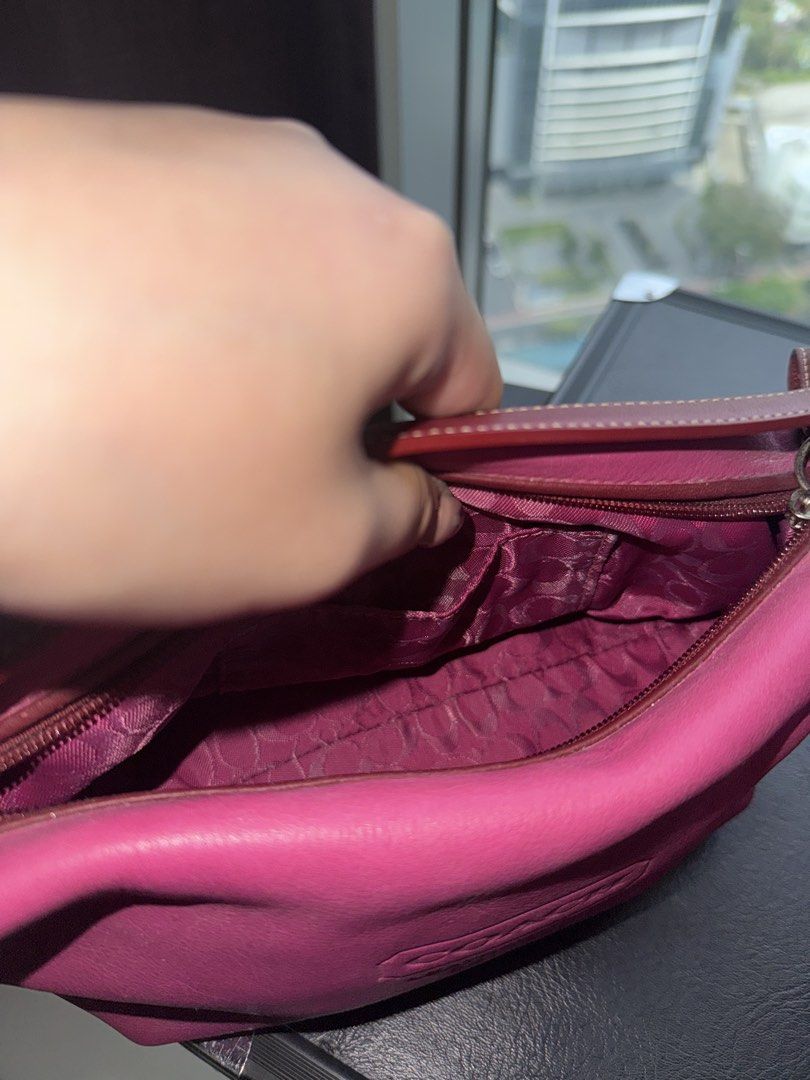 Authentic Vintage Coach Leather Pink Handbag (Category: Luxury Bags & Wallets) located in Makati City. Submitted by ll.archives (Listing ID 1423473386, Image 3). Description: - Authentic Coach handbag - Vibrant pink color - Top handle design - Coach Leatherware logo - Patterned interior lining - Includes a small pocket - Comes with Coach tag - Only needs cleaning but in good condition -No leather cracks.