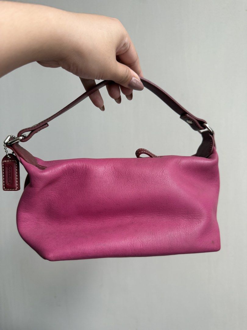 Authentic Vintage Coach Leather Pink Handbag (Category: Luxury Bags & Wallets) located in Makati City. Submitted by ll.archives (Listing ID 1423473386, Image 2). Description: - Authentic Coach handbag - Vibrant pink color - Top handle design - Coach Leatherware logo - Patterned interior lining - Includes a small pocket - Comes with Coach tag - Only needs cleaning but in good condition -No leather cracks.