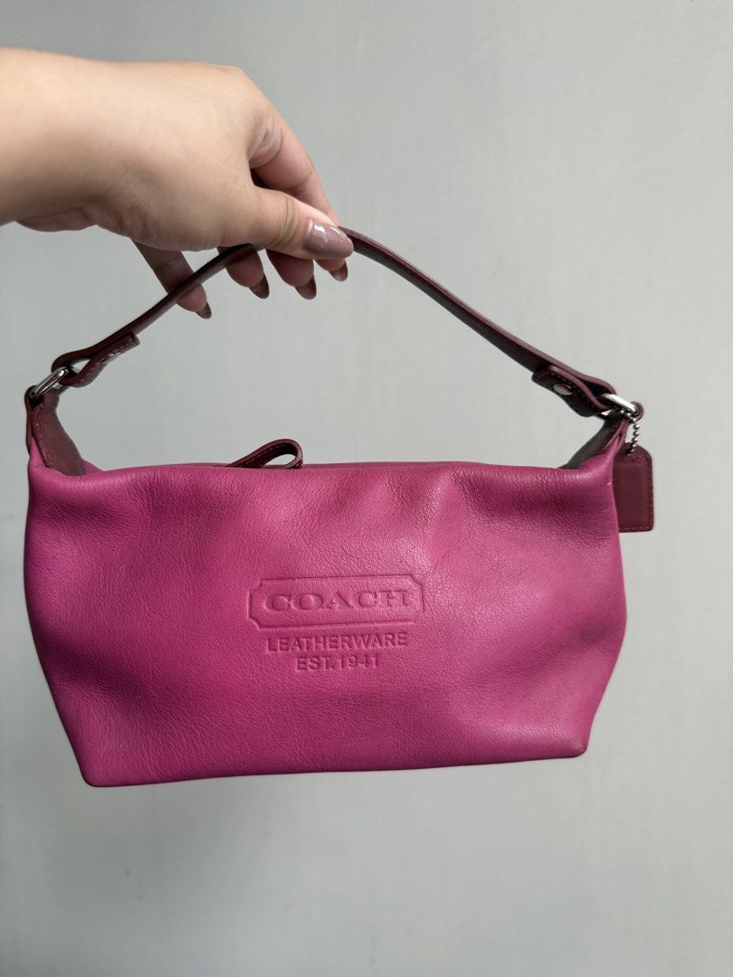 Authentic Vintage Coach Leather Pink Handbag (Category: Luxury Bags & Wallets) located in Makati City. Submitted by ll.archives (Listing ID 1423473386, Image 1). Description: - Authentic Coach handbag - Vibrant pink color - Top handle design - Coach Leatherware logo - Patterned interior lining - Includes a small pocket - Comes with Coach tag - Only needs cleaning but in good condition -No leather cracks.