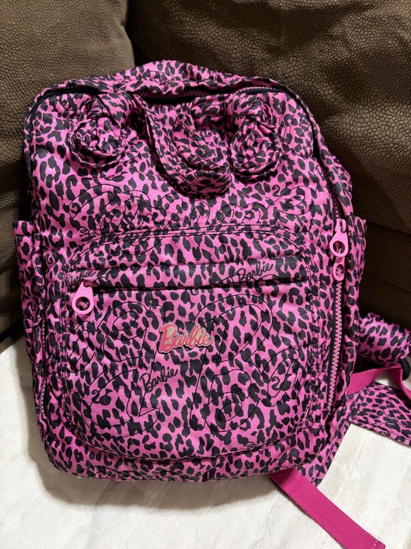 Barbie Pink Leopard Print Backpack (Category: Backpacks) located in Cagayan de Oro. Submitted by secondchances.x (Listing ID 1423541308, Image 1). Description: - Barbie Pink Leopard Print Backpack - Features a fun pink leopard print design - Genuine Barbie product - Perfect for school or everyday use - Stylish and eye-catching.