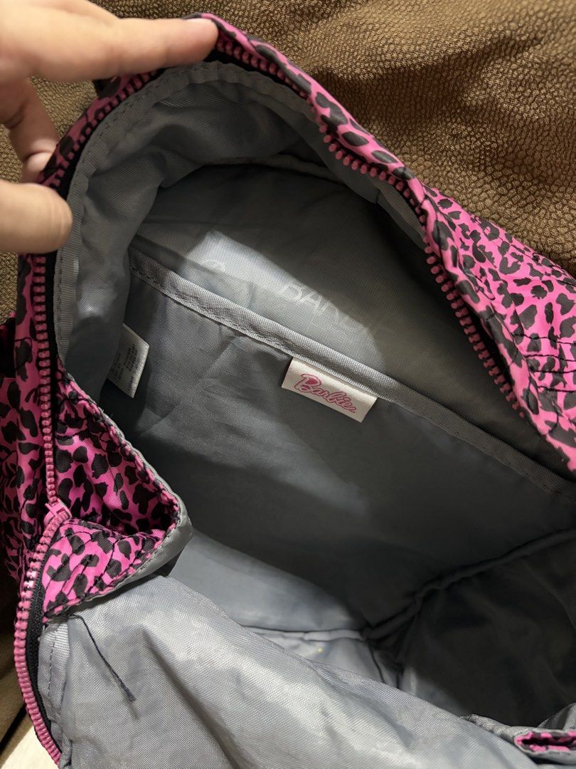 Barbie Pink Leopard Print Backpack (Category: Backpacks) located in Cagayan de Oro. Submitted by secondchances.x (Listing ID 1423541308, Image 3). Description: - Barbie Pink Leopard Print Backpack - Features a fun pink leopard print design - Genuine Barbie product - Perfect for school or everyday use - Stylish and eye-catching.