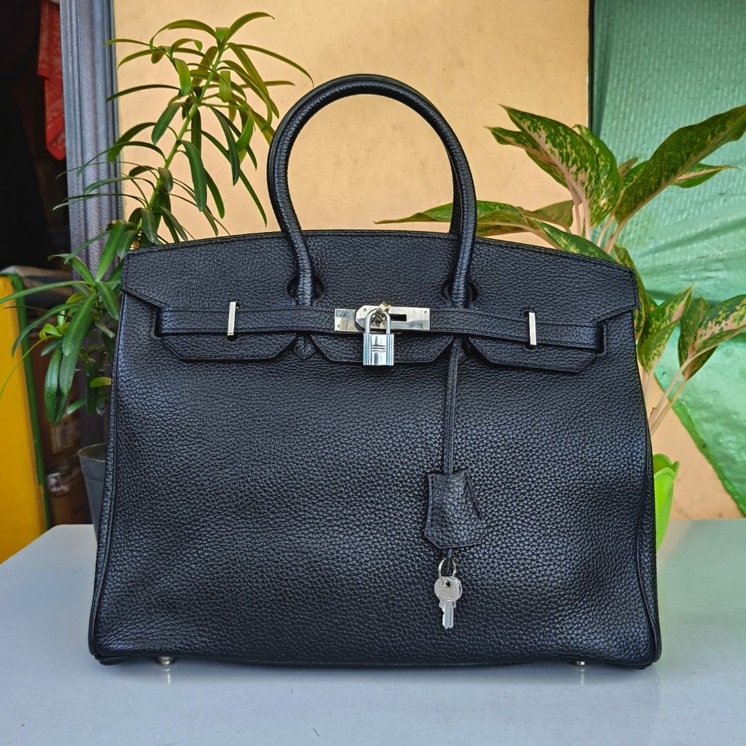 Hermes Birkin 35 complete with Lock and Keys Preloved B24 (Category: Luxury Bags & Wallets) located in Quezon City. Submitted by bagsbybhem (Listing ID 1423485985, Image 3). Description: ❗LAST PRICE POSTED❗ ❗READ DESCRIPTION❗ 📏 DIMENSIONS: 14 x 11 x 7 inches, LARGE HANDLE LENGTH: 10 inches Weight: 1.45 kg. (including lock and keys) RIRI zip, with complete lock and keys Pristine very good condition 👍💯 NO FLAW Hardwares: 10/10 SILVER Structured 