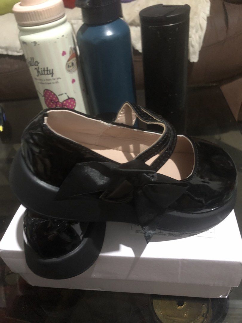 Black Mary Jane Shoes with Bow (Category: Babies & Kids Fashion) located in Morong. Submitted by brendani (Listing ID 1423502578, Image 3). Description: - Brand new black Mary Jane shoes - Features a charming bow detail - Glossy, eye-catching finish - Classic strap across the top - Durable, textured black sole - Comes in original box with manufacturer's information.