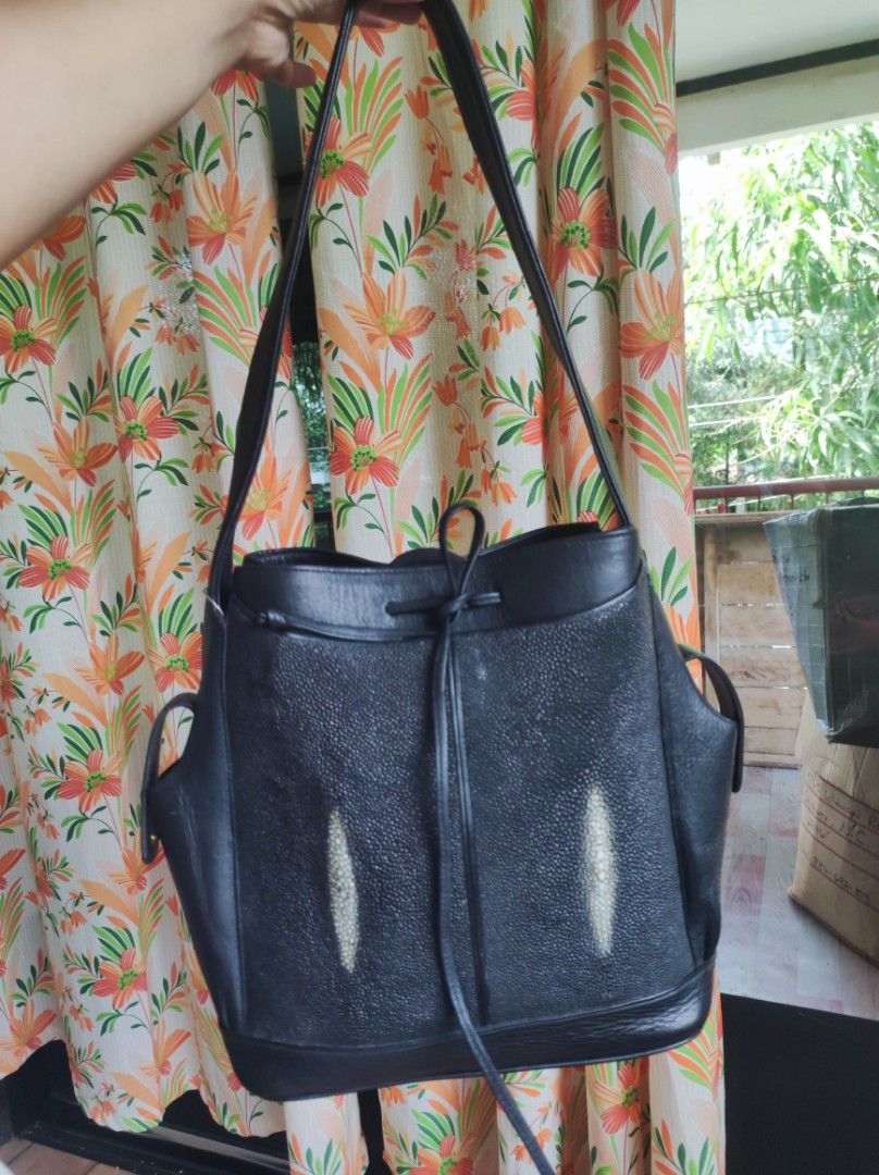 Black Stingray Leather shoulder bag (Category: Luxury Bags & Wallets) located in Zamboanga. Submitted by Clairey03 (Listing ID 1423586532, Image 2). Description: Black leather handbag with a unique stingray leather panel. Features a drawstring closure and shoulder straps. Includes side pockets for extra storage. A stylish and functional accessory for everyday use..