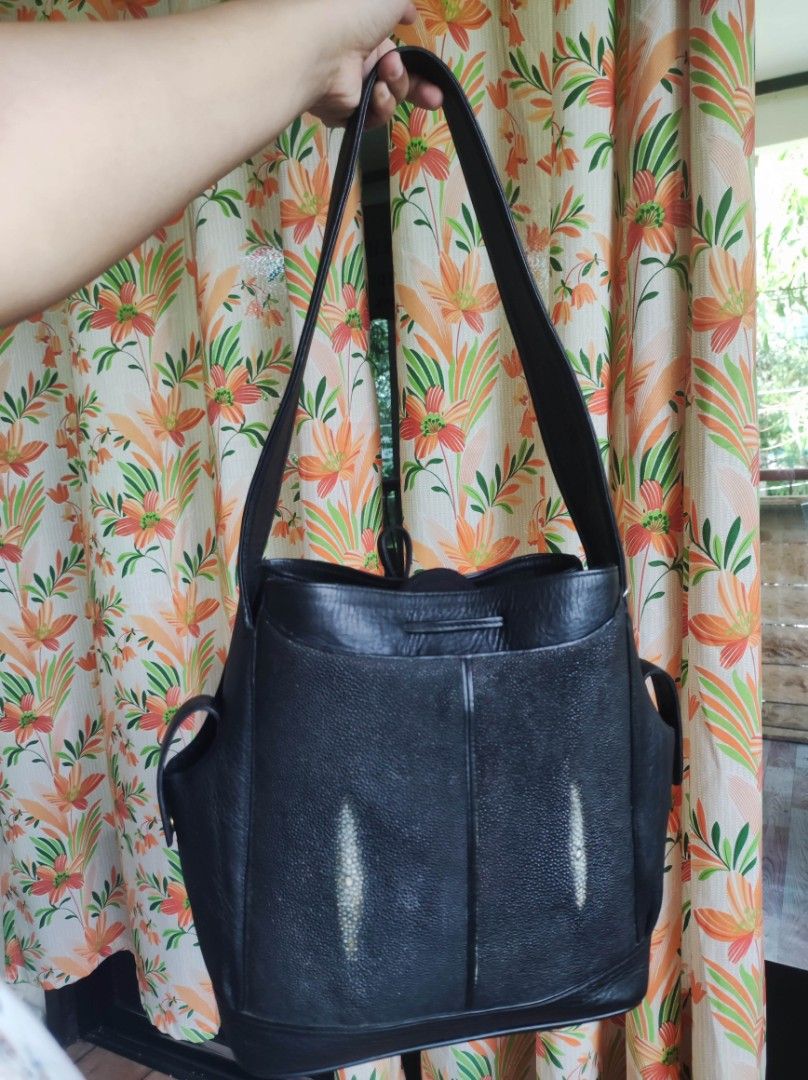Black Stingray Leather shoulder bag (Category: Luxury Bags & Wallets) located in Zamboanga. Submitted by Clairey03 (Listing ID 1423586532, Image 3). Description: Black leather handbag with a unique stingray leather panel. Features a drawstring closure and shoulder straps. Includes side pockets for extra storage. A stylish and functional accessory for everyday use..